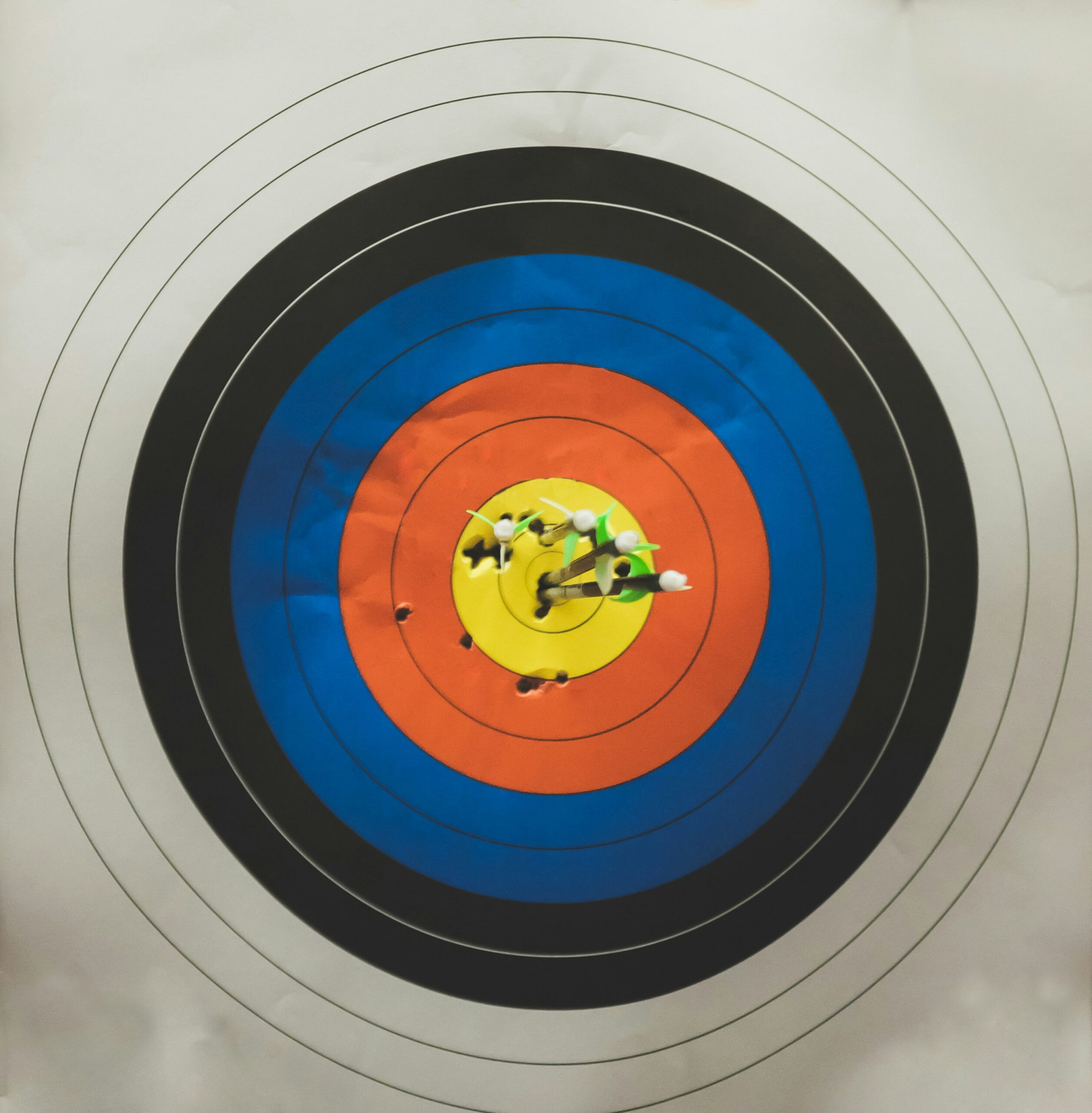 Photo of arrows in a target by Kenny Eliason on Unsplash